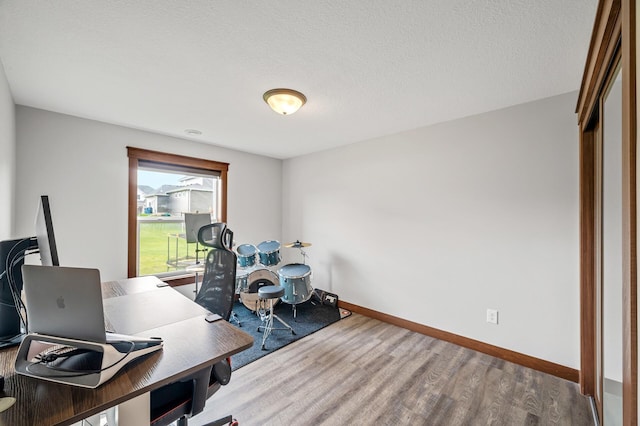 1840 Old Mill Ct, Centerville, MN 55038 - office area featuring wood finished floors, baseboards, and a textured ceiling