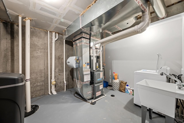 1840 Old Mill Ct, Centerville, MN 55038 - unfinished below grade area featuring washer / clothes dryer, heating unit, a water softener system, and a sink