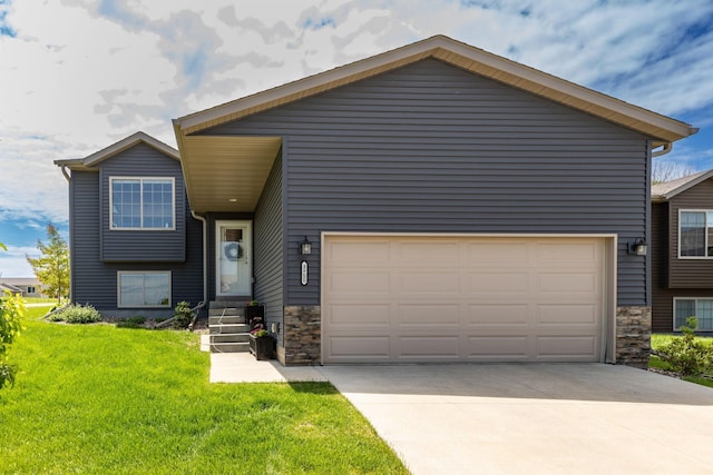 3900 Orchardview Ln NW, Rochester, MN 55901 - split level home with a garage, stone siding, and driveway