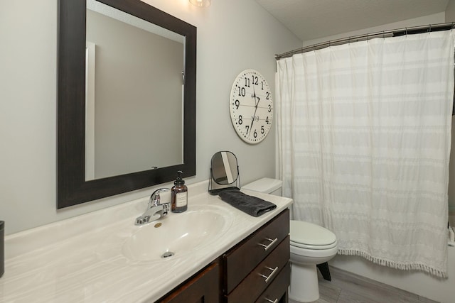 3900 Orchardview Ln NW, Rochester, MN 55901 - bathroom featuring toilet, vanity, wood finished floors, and a shower with shower curtain