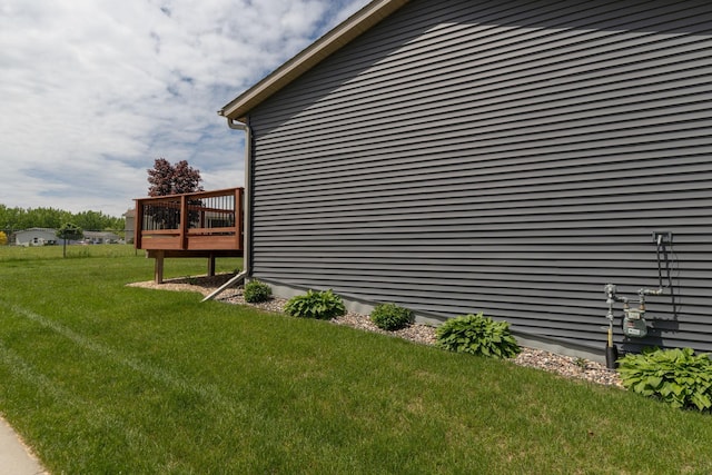 3900 Orchardview Ln NW, Rochester, MN 55901 - view of home's exterior with a deck and a lawn