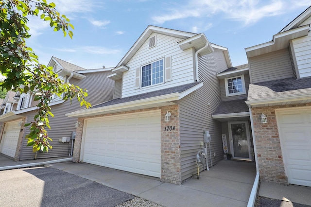 1704 Talon Trl, Eagan, MN 55122 - view of front facade with a garage and a shingled roof