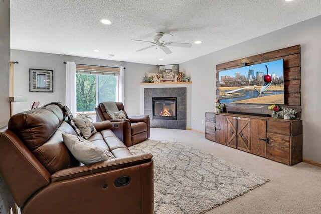 1704 Talon Trl, Eagan, MN 55122 - carpeted living area with a ceiling fan, a fireplace, a textured ceiling, recessed lighting, and baseboards