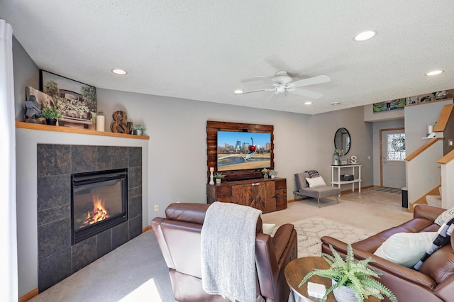 1704 Talon Trl, Eagan, MN 55122 - living room with carpet flooring, a tiled fireplace, recessed lighting, ceiling fan, and stairs