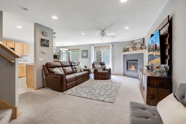 1704 Talon Trl, Eagan, MN 55122 - living room with light carpet, a tiled fireplace, recessed lighting, ceiling fan, and a textured ceiling