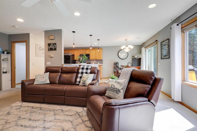 1704 Talon Trl, Eagan, MN 55122 - living room with light colored carpet, a chandelier, recessed lighting, baseboards, and a textured ceiling