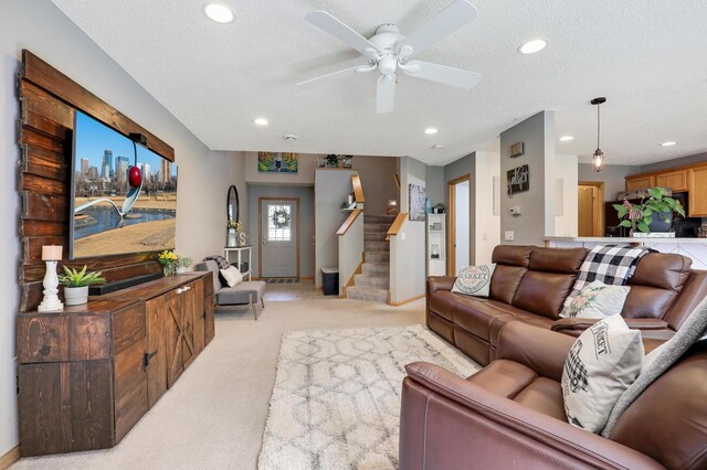 1704 Talon Trl, Eagan, MN 55122 - living room featuring light colored carpet, stairway, recessed lighting, a ceiling fan, and a textured ceiling