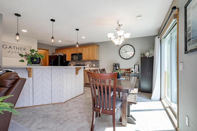 1704 Talon Trl, Eagan, MN 55122 - dining room with a chandelier, recessed lighting, light tile patterned floors, and a textured ceiling