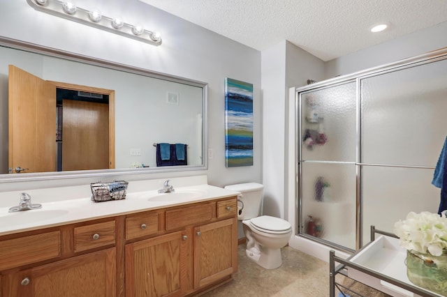1704 Talon Trl, Eagan, MN 55122 - bathroom with double vanity, toilet, a stall shower, and a textured ceiling