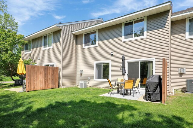 1704 Talon Trl, Eagan, MN 55122 - back of property featuring a yard, a patio, and central air condition unit