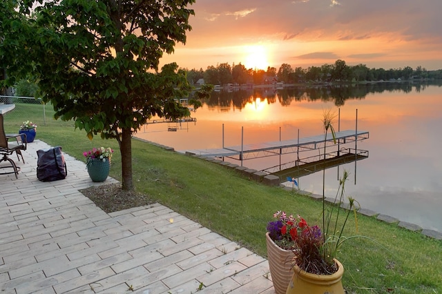 27096 Little Floyd Lake Rd Unit 2, Detroit Twp, MN 56501 - patio terrace at dusk with a water view, a patio area, and a floating dock
