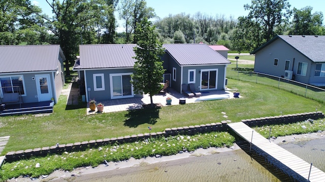 27096 Little Floyd Lake Rd Unit 2, Detroit Twp, MN 56501 - back of house featuring a patio area and metal roof
