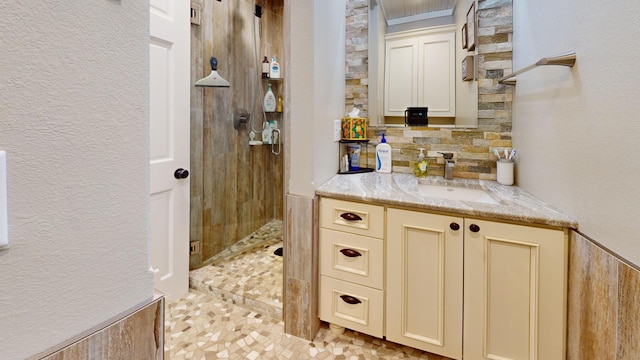 27096 Little Floyd Lake Rd Unit 2, Detroit Twp, MN 56501 - full bath with a stall shower, vanity, a textured wall, and tasteful backsplash