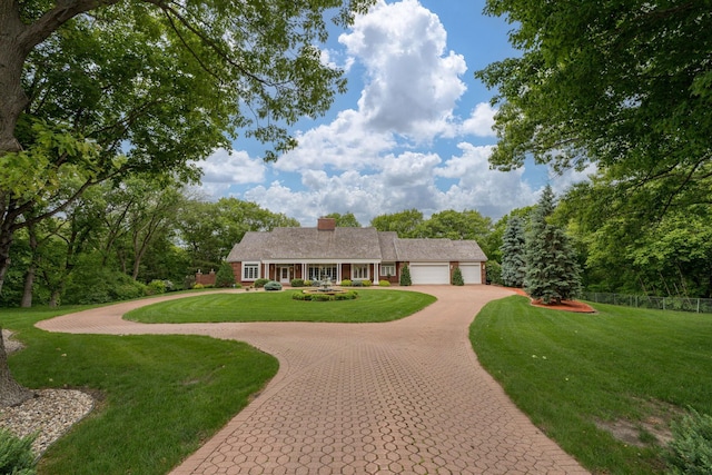 17 Oriole Pl, North Mankato, MN 56003 - ranch-style home featuring an attached garage, curved driveway, and a chimney