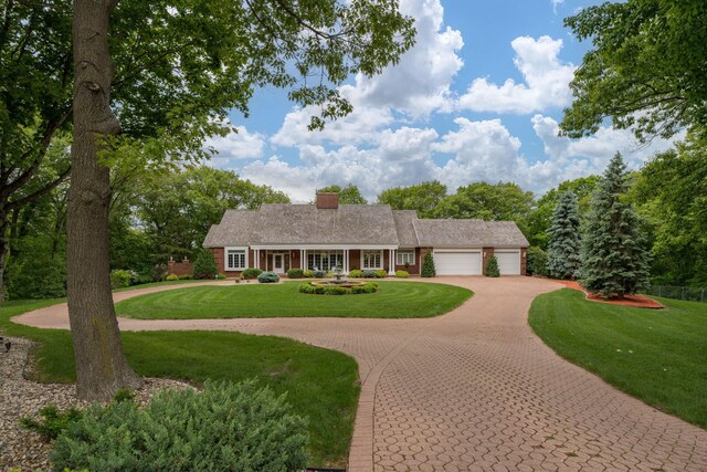 17 Oriole Pl, North Mankato, MN 56003 - single story home with a garage, driveway, a front yard, and a chimney