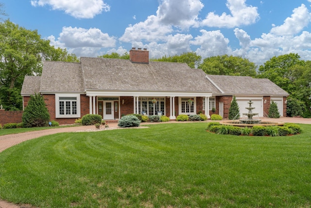17 Oriole Pl, North Mankato, MN 56003 - cape cod home with brick siding, an attached garage, and a front yard