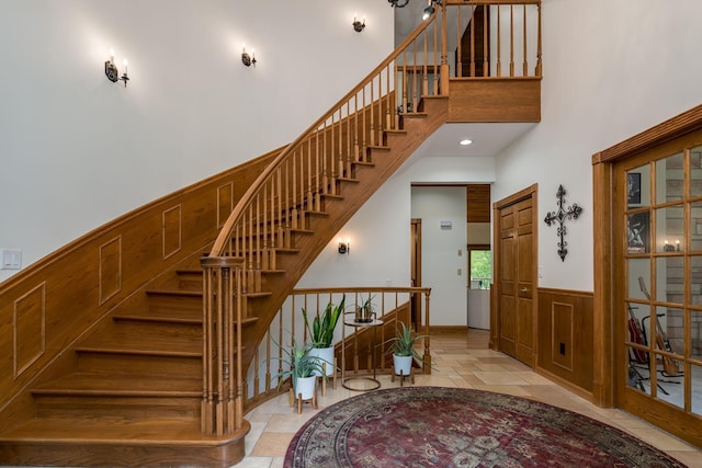 17 Oriole Pl, North Mankato, MN 56003 - staircase with a towering ceiling and a wainscoted wall
