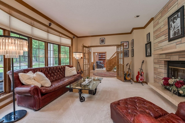 17 Oriole Pl, North Mankato, MN 56003 - living room with carpet flooring, crown molding, a chandelier, stairway, and a stone fireplace