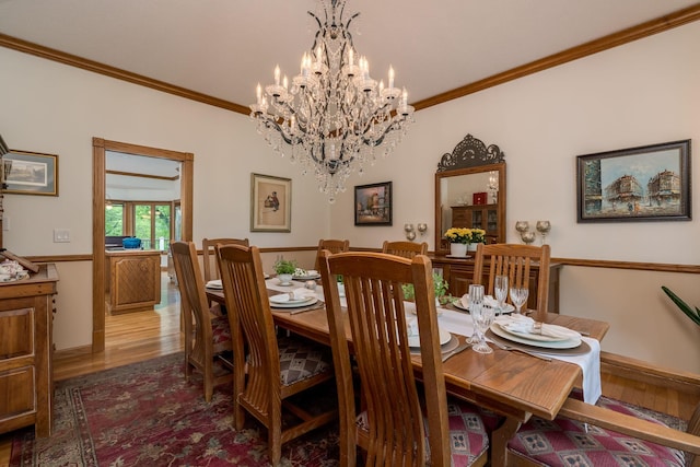 17 Oriole Pl, North Mankato, MN 56003 - dining room featuring crown molding, wood finished floors, and a chandelier