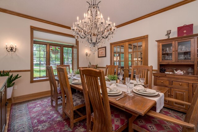 17 Oriole Pl, North Mankato, MN 56003 - dining space with french doors, ornamental molding, a chandelier, baseboards, and wood finished floors