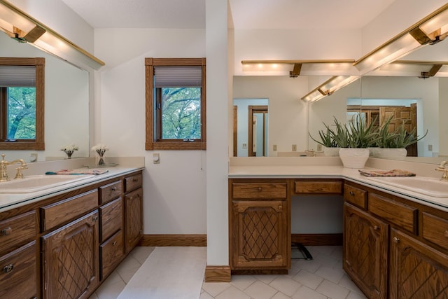 17 Oriole Pl, North Mankato, MN 56003 - bathroom featuring vanity, tile patterned flooring, and baseboards