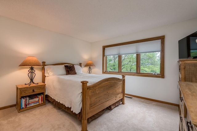 17 Oriole Pl, North Mankato, MN 56003 - bedroom featuring baseboards and light carpet