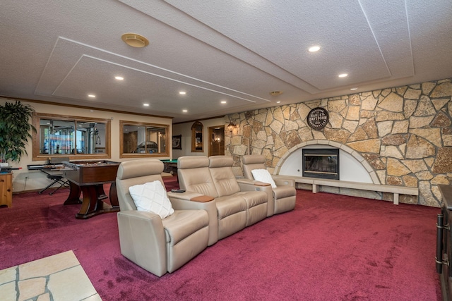 17 Oriole Pl, North Mankato, MN 56003 - carpeted living area featuring a textured ceiling, recessed lighting, and a stone fireplace
