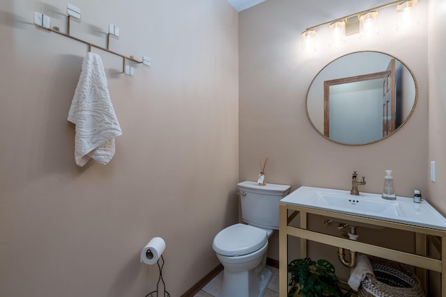 17 Oriole Pl, North Mankato, MN 56003 - half bath featuring toilet, a sink, baseboards, and tile patterned flooring