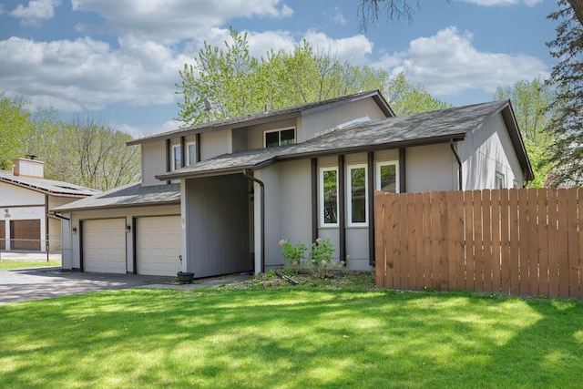 1158 Rockstone Ln, New Brighton, MN 55112 - view of front of property featuring an attached garage and asphalt driveway