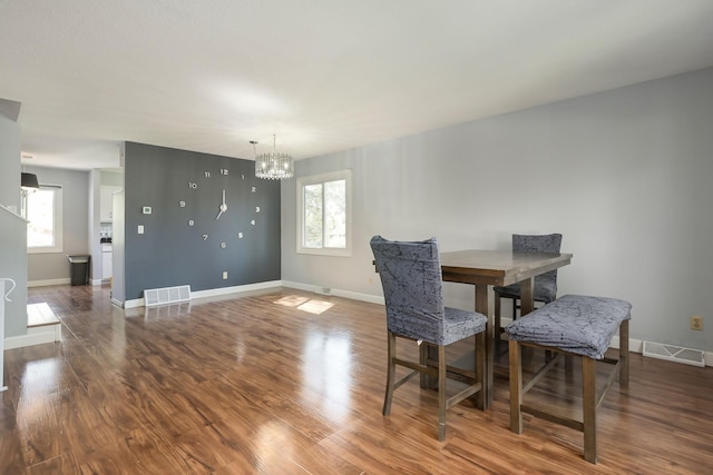 1158 Rockstone Ln, New Brighton, MN 55112 - dining area with a chandelier, healthy amount of natural light, baseboards, and wood finished floors