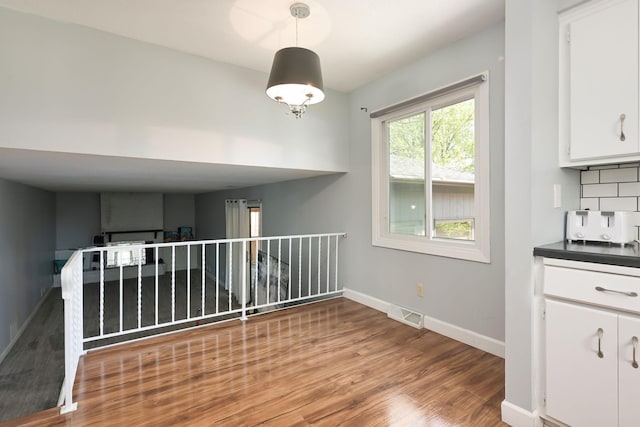 1158 Rockstone Ln, New Brighton, MN 55112 - unfurnished dining area with wood finished floors and baseboards