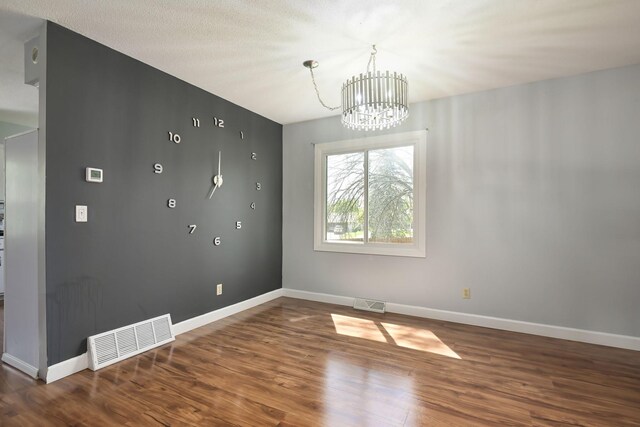 1158 Rockstone Ln, New Brighton, MN 55112 - spare room featuring a chandelier, wood finished floors, and baseboards