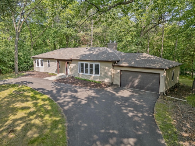 11600 Timberline Rd, Minnetonka, MN 55305 - ranch-style house featuring asphalt driveway, a garage, a chimney, and a shingled roof