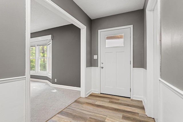 11600 Timberline Rd, Minnetonka, MN 55305 - entrance foyer featuring wood finished floors and a wainscoted wall