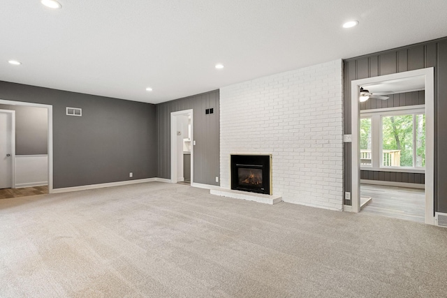 11600 Timberline Rd, Minnetonka, MN 55305 - unfurnished living room with carpet floors, a brick fireplace, recessed lighting, baseboards, and a ceiling fan