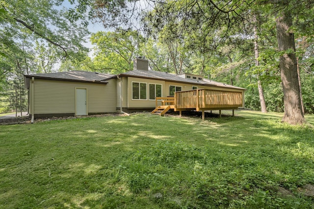 11600 Timberline Rd, Minnetonka, MN 55305 - back of property featuring a chimney, a wooden deck, and a lawn