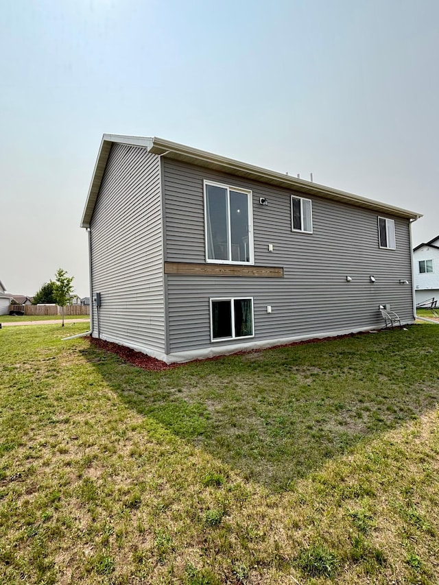 1020 7th Ave NW, Rice, MN 56367 - rear view of house with a yard