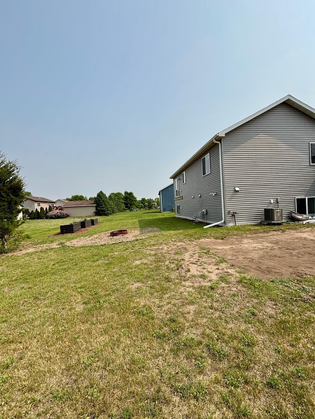 1020 7th Ave NW, Rice, MN 56367 - view of green lawn featuring central AC
