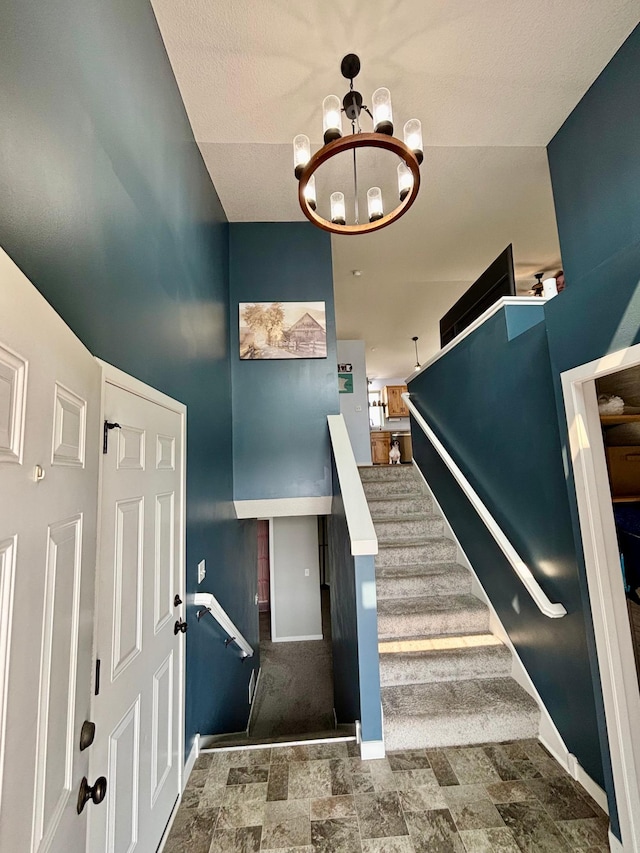 1020 7th Ave NW, Rice, MN 56367 - stairway with a chandelier and baseboards