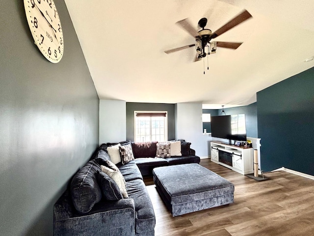 1020 7th Ave NW, Rice, MN 56367 - living room with plenty of natural light, a ceiling fan, wood finished floors, and baseboards