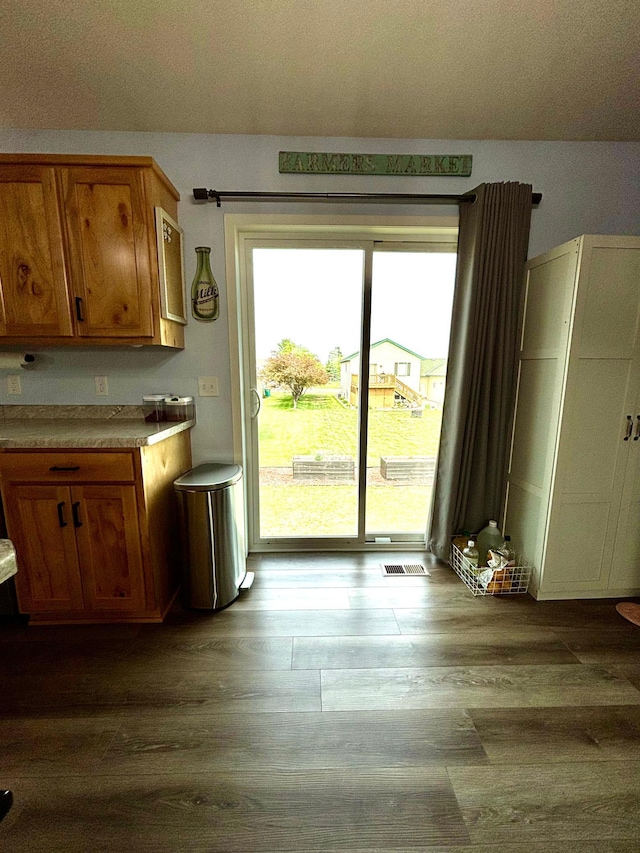 1020 7th Ave NW, Rice, MN 56367 - kitchen featuring wood finished floors and brown cabinetry