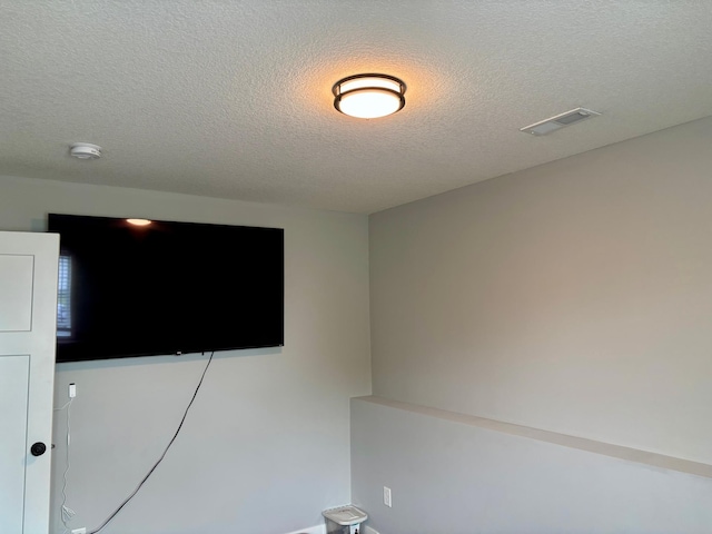 1020 7th Ave NW, Rice, MN 56367 - detailed view of a smoke detector and a textured ceiling
