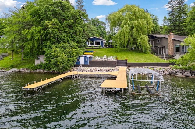 1811 Pulaski Rd, Buffalo, MN 55313 - dock with boat lift, a water view, and a lawn