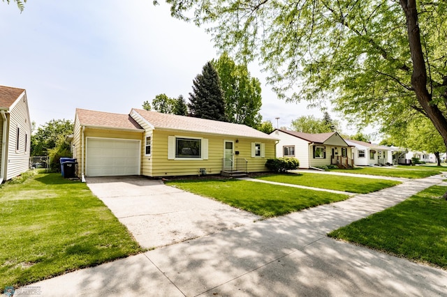1633 1st St N, Fargo, ND 58102 - ranch-style house with an attached garage, concrete driveway, and a front yard