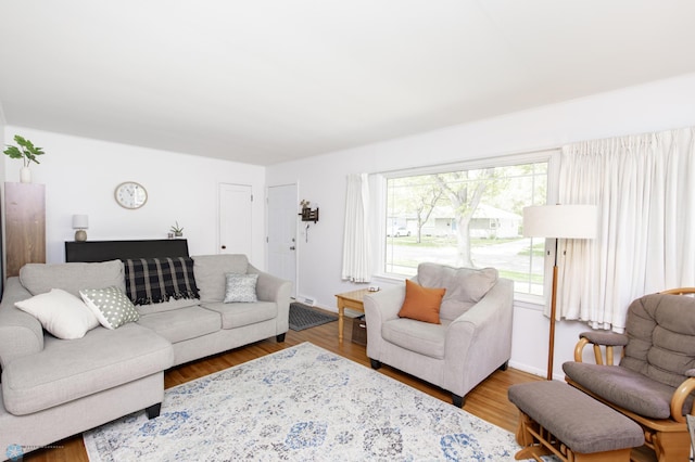 1633 1st St N, Fargo, ND 58102 - living room featuring wood finished floors and baseboards
