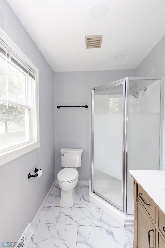 1633 1st St N, Fargo, ND 58102 - bathroom with toilet, vanity, a stall shower, marble finish flooring, and baseboards