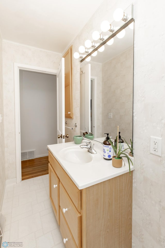 1633 1st St N, Fargo, ND 58102 - bathroom with vanity and baseboards