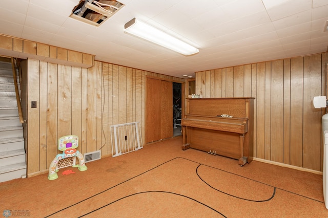 1633 1st St N, Fargo, ND 58102 - finished basement with wooden walls, carpet, and stairway