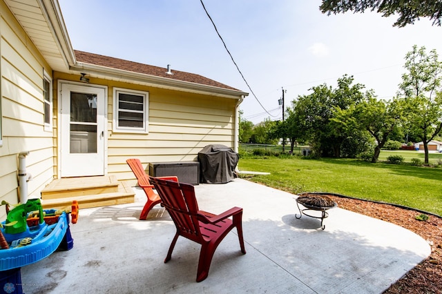 1633 1st St N, Fargo, ND 58102 - view of patio with an outdoor fire pit and grilling area