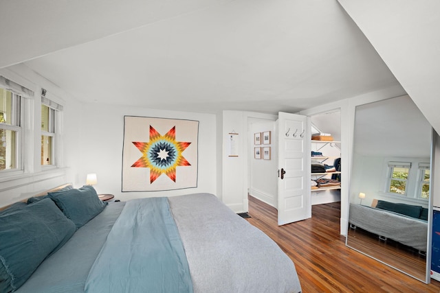 1144 Abell St, Saint Paul, MN 55117 - bedroom featuring wood finished floors, a walk in closet, and baseboards